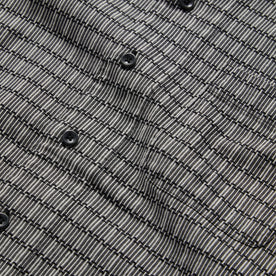 material shot of the buttons on The Short Sleeve Hawthorne in Navy Stripe, Wovens by Taylor Stitch