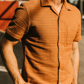 fit model showing the front of The Short Sleeve Hawthorne in Rust Pickstitch Waffle, Wovens by Taylor Stitch