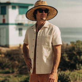 fit model wearing The Short Sleeve Hawthorne in Sand unbuttoned, Wovens by Taylor Stitch