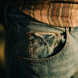 fit model showing the pocket detail of The Slim Jean in Patch Wash Selvage, Bottoms by Taylor Stitch