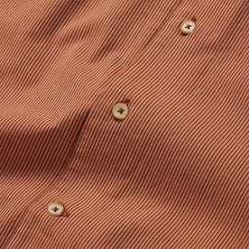 material shot of the buttons on The Tulum in Rust Stripe, Wovens by Taylor Stitch