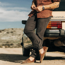 fit model leaning against a vintage mercedes in The Apres Pant in Shadow Hemp, Bottoms by Taylor Stitch