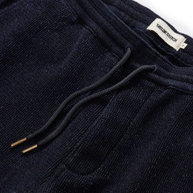 material shot of the drawcord and elasticated waist on The Apres Short in Indigo Waffle, Bottoms by Taylor Stitch