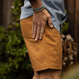 fit model showing the side of The Camp Short in Cedar Boss Duck, Bottoms by Taylor Stitch