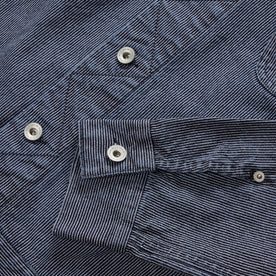 material shot of the YKK hardware on The Long Haul Jacket in Washed Indigo Stripe, Outerwear by Taylor Stitch