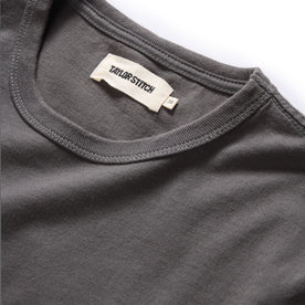 material shot of the neck opening on The Organic Cotton Tee in Faded Black, Knits by Taylor Stitch