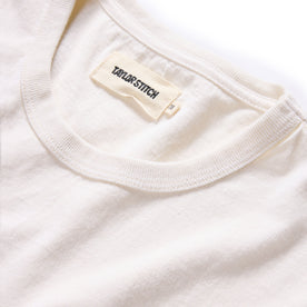 material shot of the neck opening on The Organic Cotton Tee in Vintage White, Knits by Taylor Stitch