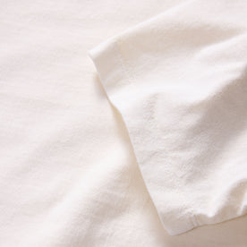 material shot of the sleeve on The Organic Cotton Tee in Vintage White, Knits by Taylor Stitch