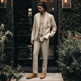 fit model standing by a doorway in The Sheffield Sport Coat in Natural Linen, Outerwear by Taylor Stitch