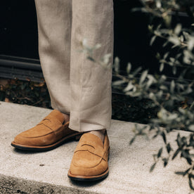 fit model wearing The Sheffield Trouser in Natural Linen and a pair of tan loafers, Bottoms by Taylor Stitch