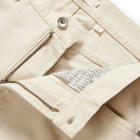 material shot of the button fly undone on The Slim All Day Pant in Dune Canvas, Bottoms by Taylor Stitch