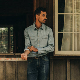 fit model wearing The Ledge Shirt in Sun Bleached Chambray, looking right, Wovens by Taylor Stitch