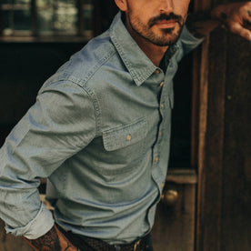 fit model wearing The Ledge Shirt in Sun Bleached Chambray, up close of sleeve, Wovens by Taylor Stitch