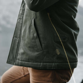 fit model showing quarter top pocket profile of The Lined Watts Jacket in Olive, Outerwear by Taylor Stitch