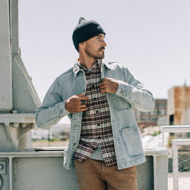 fit model wearing The Ojai Jacket in Washed Denim, layered over flannel, looking right, Outerwear by Taylor Stitch