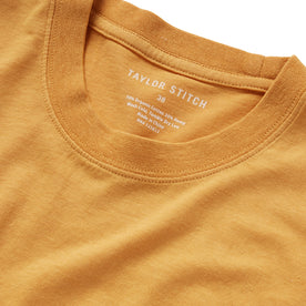 material shot of the collar on The Cotton Hemp Tee in Mustard, Knits by Taylor Stitch