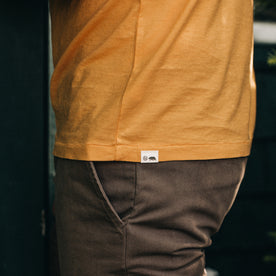 fit model showing the side of The Cotton Hemp Tee in Mustard, Knits by Taylor Stitch