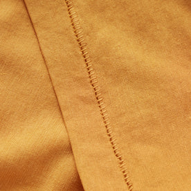 material shot of the sleeve on The Cotton Hemp Tee in Mustard, Knits by Taylor Stitch