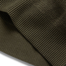 material shot of the hem of The Hugo Sweater in Army, Knits by Taylor Stitch