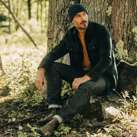 fit model sitting in The Slim Jean in Umeda Selvage, Bottoms by Taylor Stitch