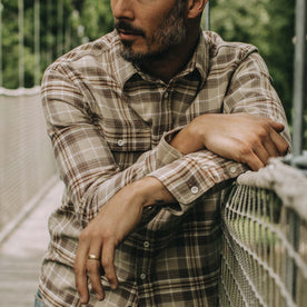 fit model posing in The Ledge Shirt in Fossil Plaid, Wovens by Taylor Stitch