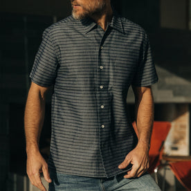 fit model posing in The Short Sleeve Hawthorne in Navy Dobby, Wovens by Taylor Stitch