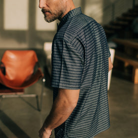 fit model walking in The Short Sleeve Hawthorne in Navy Dobby, Wovens by Taylor Stitch