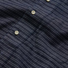 material shot of the buttons on The Short Sleeve Hawthorne in Navy Dobby, Wovens by Taylor Stitch