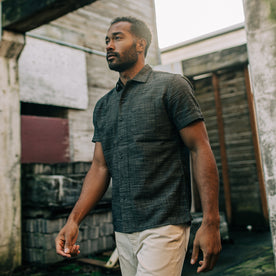 fit mdoel walking outside in The Short Sleeve Hawthorne in Navy Wave, Wovens by Taylor Stitch