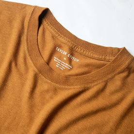 material shot of collar with interior printed label shown, Knits by Taylor Stitch