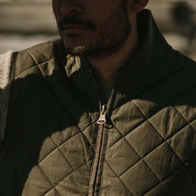 Fit model wearing The Quilted Bomber Vest in Olive Dry Wax with close up of collar, Outerwear by Taylor Stitch