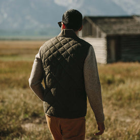 Fit model wearing The Quilted Bomber Vest in Olive Dry Wax showing back, Outerwear by Taylor Stitch