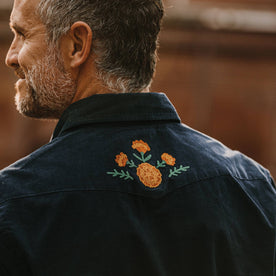 fit model wearing The Western Shirt in Better Together showing embroidery on back yoke, Wovens by Taylor Stitch