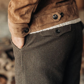 fit model with his hand in his pocket of The Carnegie Pant in Army Herringbone Wool, Bottoms by Taylor Stitch