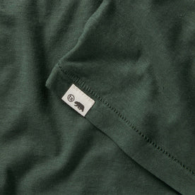 material shot of the logo on The Cotton Hemp Tee in Pine, Knits by Taylor Stitch