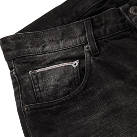 material shot of selvage 5th pocket on The Democratic Jean in Black 3-Month Wash Selvage, Bottoms by Taylor Stitch