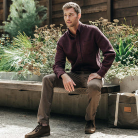 fit model sitting in The Jack in Burgundy Jaspe Waffle, Wovens by Taylor Stitch