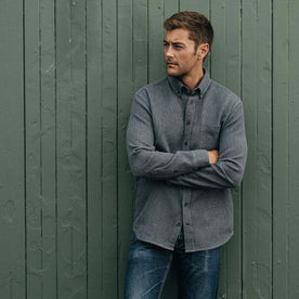 fit model posing against the wall in The Jack in Coal Jaspe Waffle, Wovens by Taylor Stitch