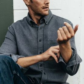 fit model adjusting sleeves on The Jack in Coal Jaspe Waffle, Wovens by Taylor Stitch