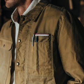 fit model showing off the pockets of The Lined Longshore Jacket in Harvest Tan Waxed Canvas, Outerwear by Taylor Stitch