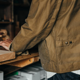 fit model showing pockets and hem on The Lined Longshore Jacket in Harvest Tan Waxed Canvas, Outerwear by Taylor Stitch