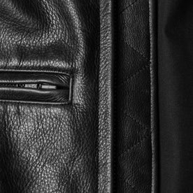 material shot of the zipper and pocket for The Moto Jacket in Black Steerhide, Outerwear by Taylor Stitch