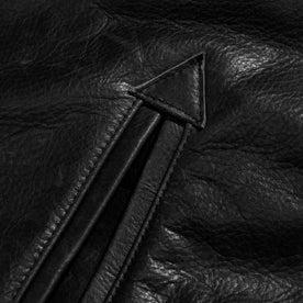 material shot of the pocket of The Moto Jacket in Black Steerhide, Outerwear by Taylor Stitch