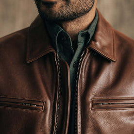 fit model sitting in The Moto Jacket in Espresso Steerhide, Outerwear by Taylor Stitch