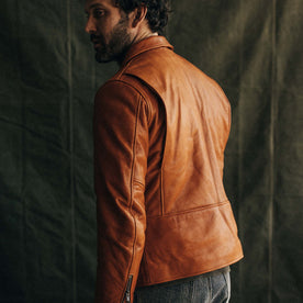 fit model showing the back of The Moto Jacket in Whiskey Steerhide, Outerwear by Taylor Stitch