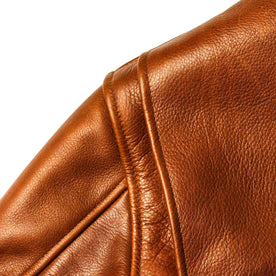 material shot of the shoulder detail on The Moto Jacket in Whiskey Steerhide, Outerwear by Taylor Stitch