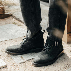 fit model showing off side detail on The Moto Boot in Black Weatherproof Nubuck, Footwear by Taylor Stitch