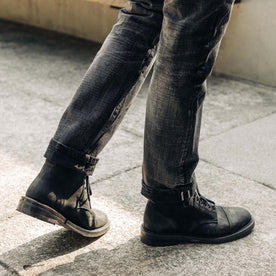 fit model walking in The Moto Boot in Black Weatherproof Nubuck, Footwear by Taylor Stitch