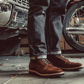 fit model showing off the side of The Moto Boot in Snuff Weatherproof Suede, Footwear by Taylor Stitch