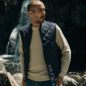 fit model walking in The Quilted Bomber Vest in Navy Dry Wax, Outerwear by Taylor Stitch